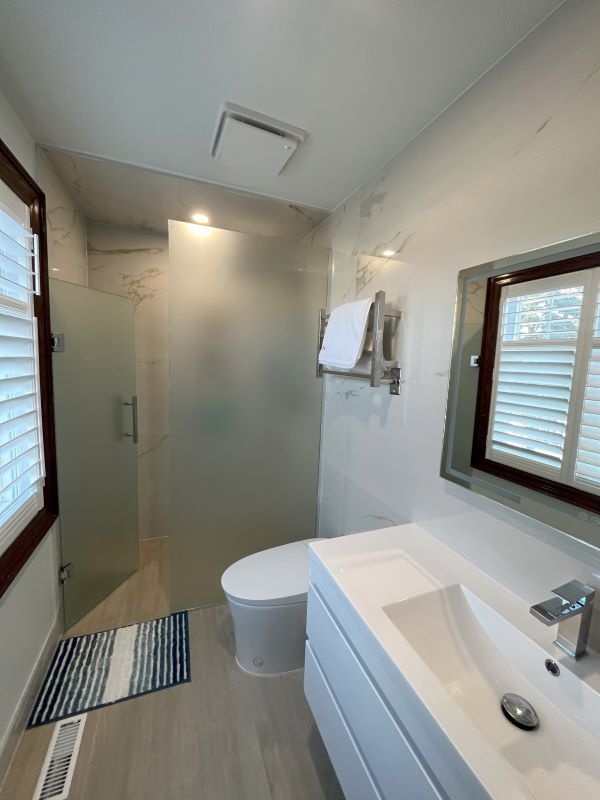 woodbridge small bathroom renovation insatallation curbless glass shower custom niche fly vanity smart toilet electric heated towel rail underfloor heating 6 Aurora