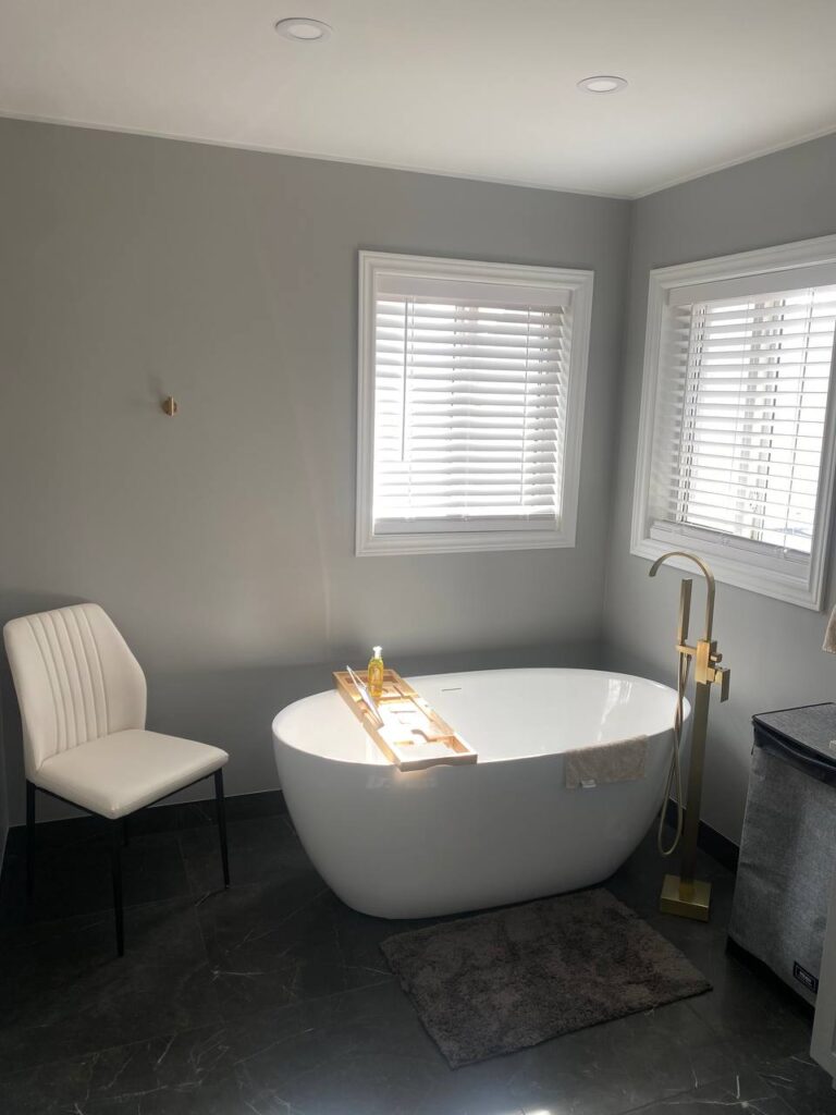 freestanding bathtub gold fixtures and marble floor photo 2024 05 25 19 30 30