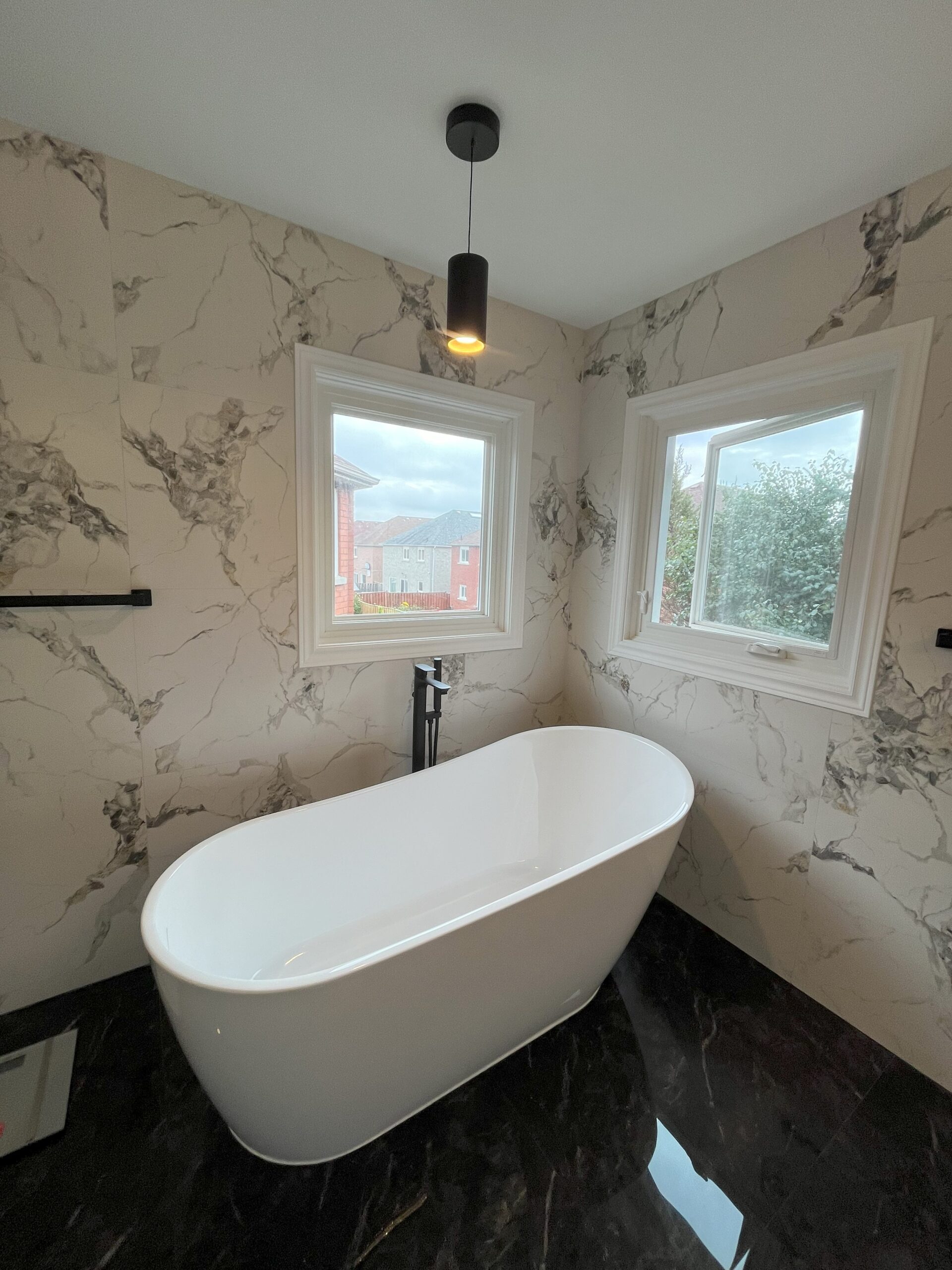 bathroom renovations in toronto Modern Bathroom with Black and White Marble-Effect Tile