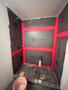 We install the shower pan, curb, and drain with a strong adhesive mortar for a watertight seal