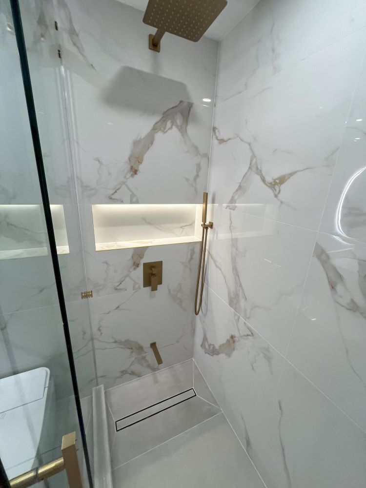 Markham bathroom renovations glass shower with custom niche and led lighting