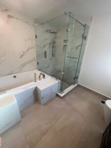 new Hydromassage Tub and L shaped frameless glass shower enclosure Thornhill