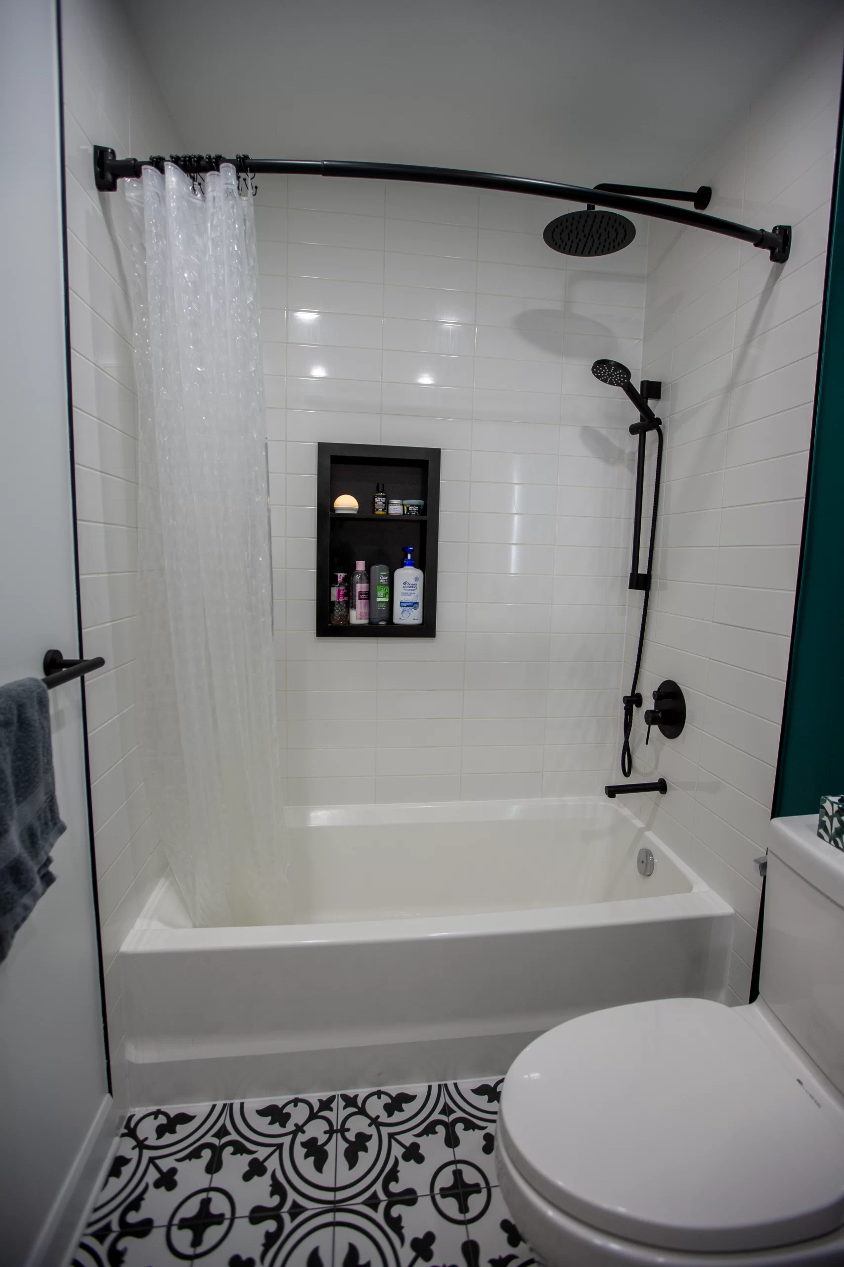 Minimalist alcove bathtub design with matte black fixtures subway tile Barrie
