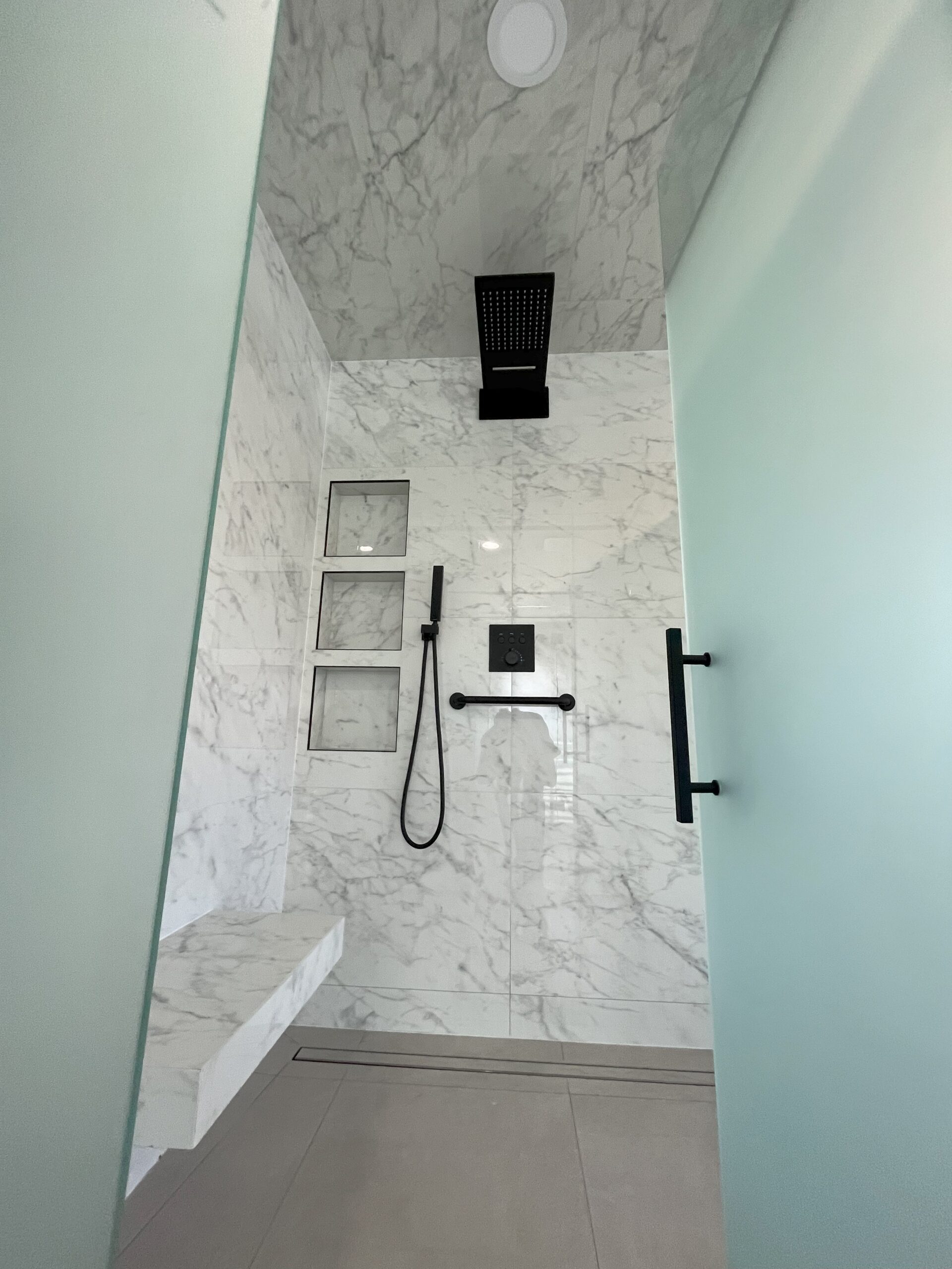 bathroom tub to shower remodel, insatallation curbless glass shower 3 custom niches tiled seat 2 bathroom renovation services Barrie