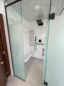 insatallation curbless glass shower 3 custom niches tiled seat bathroom installation