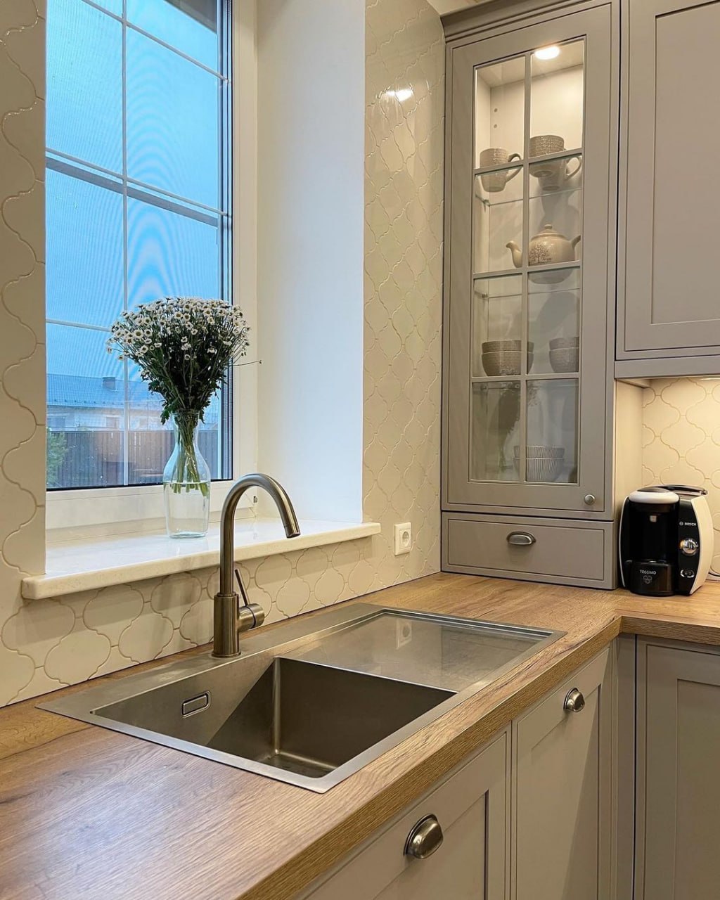 Custom cabinetry extending to ceiling with glass front doors Pickering