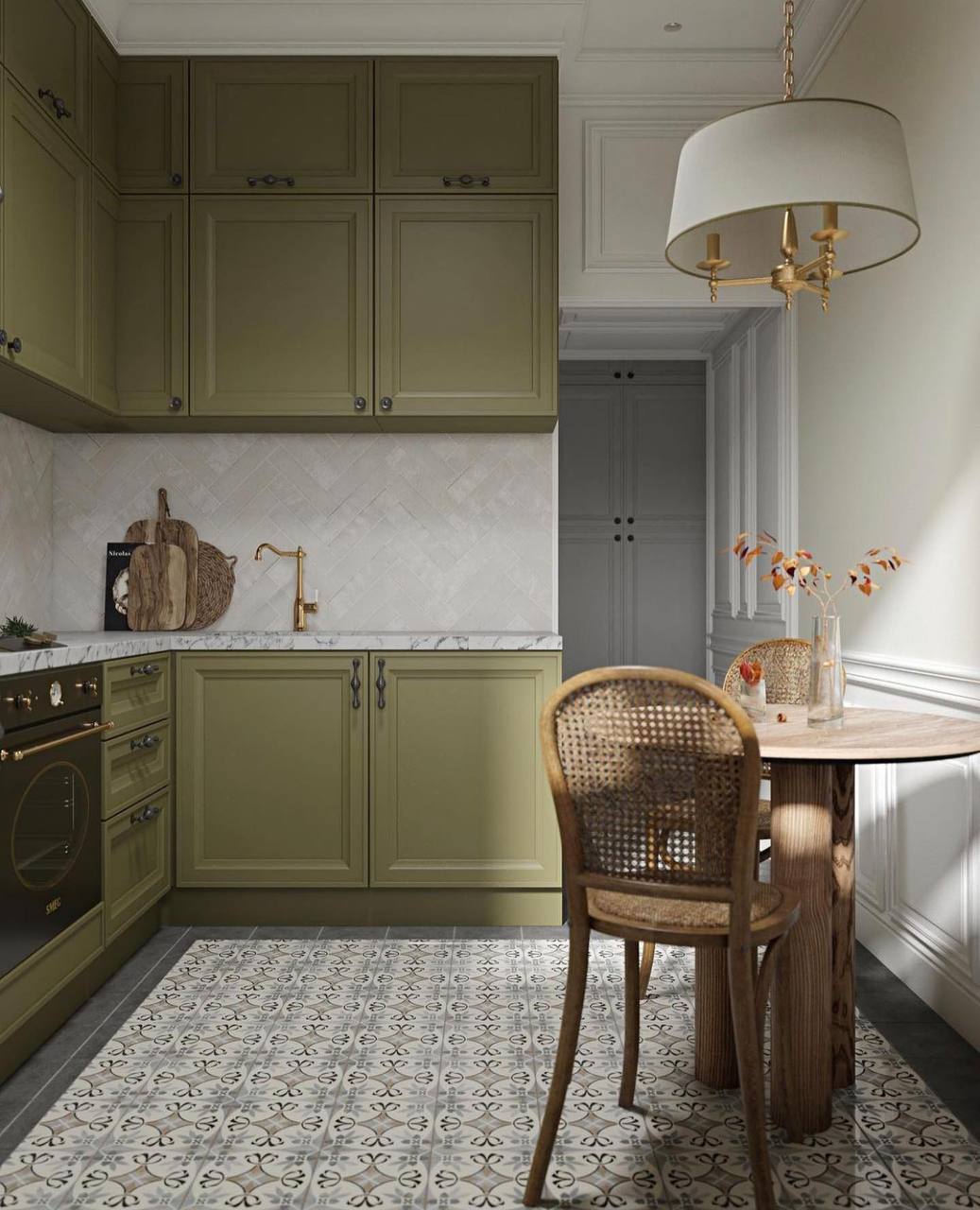 Transitional green kitchen with a small wooden dining table and rattan chairs, featuring vintage pendant lighting Pickering
