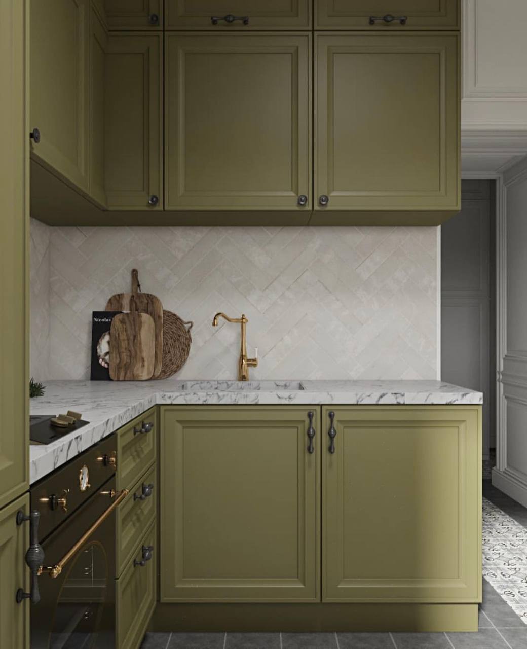Transitional olive green kitchen with brass faucet, classic white marble countertop, and a subtle white herringbone tile backsplash Pickering