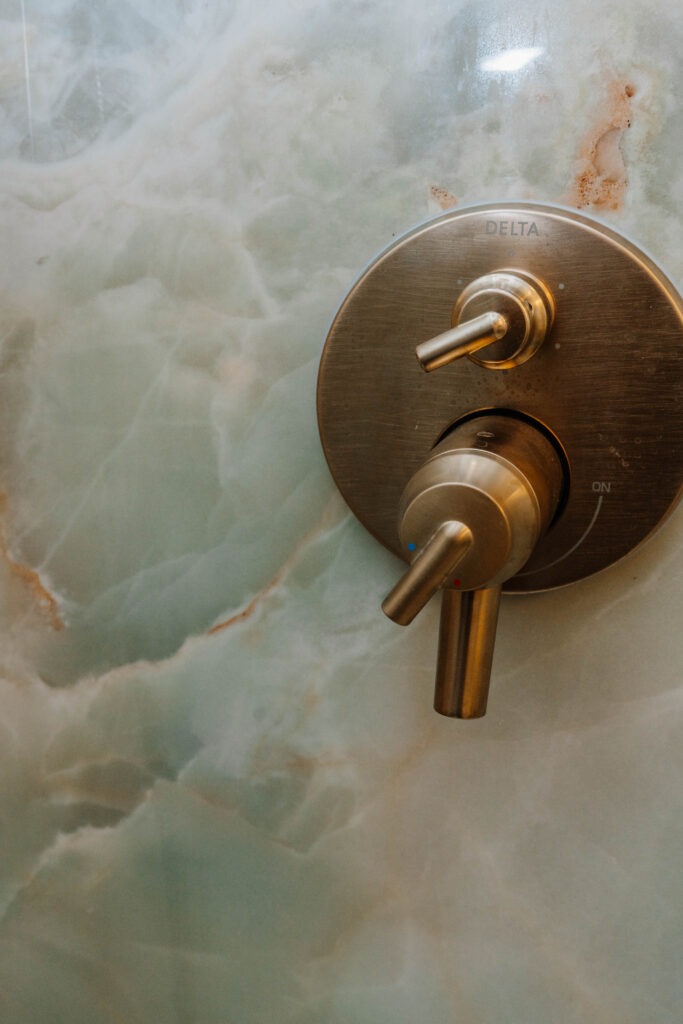 Delta champagne bronze shower valve with diverter for body jets and rain head