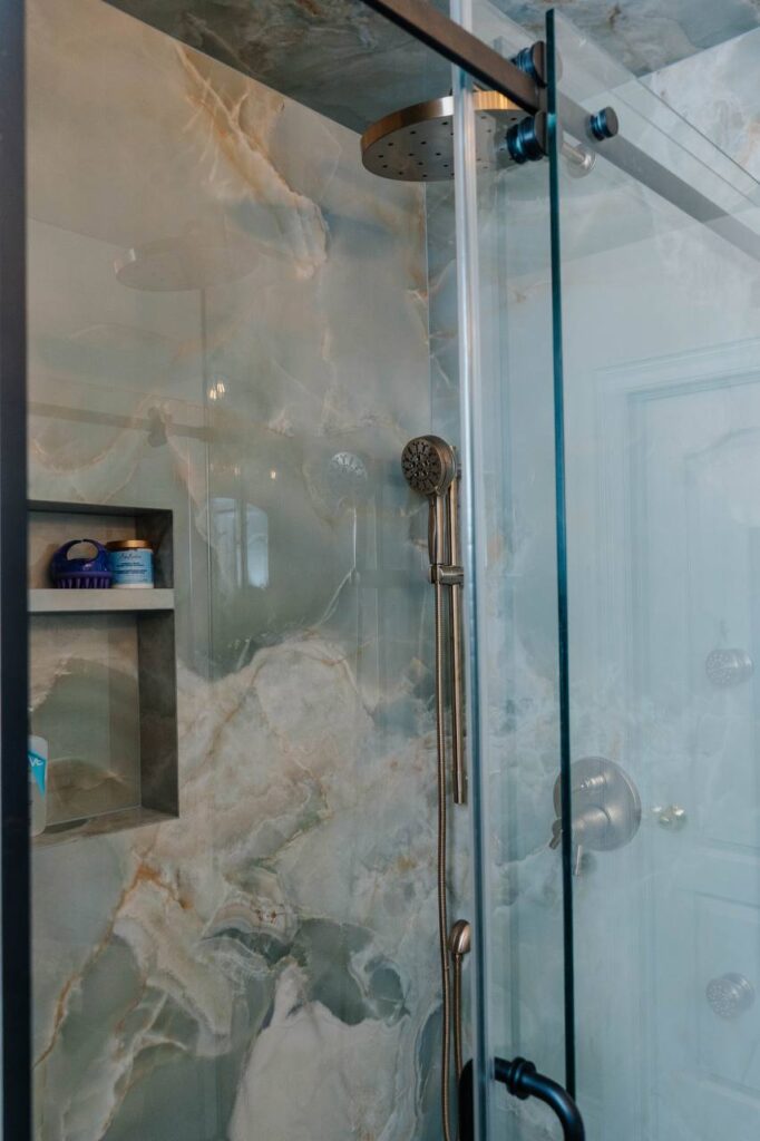 (Shower Door) Custom glass sliding shower door with black hardware and body jets system
