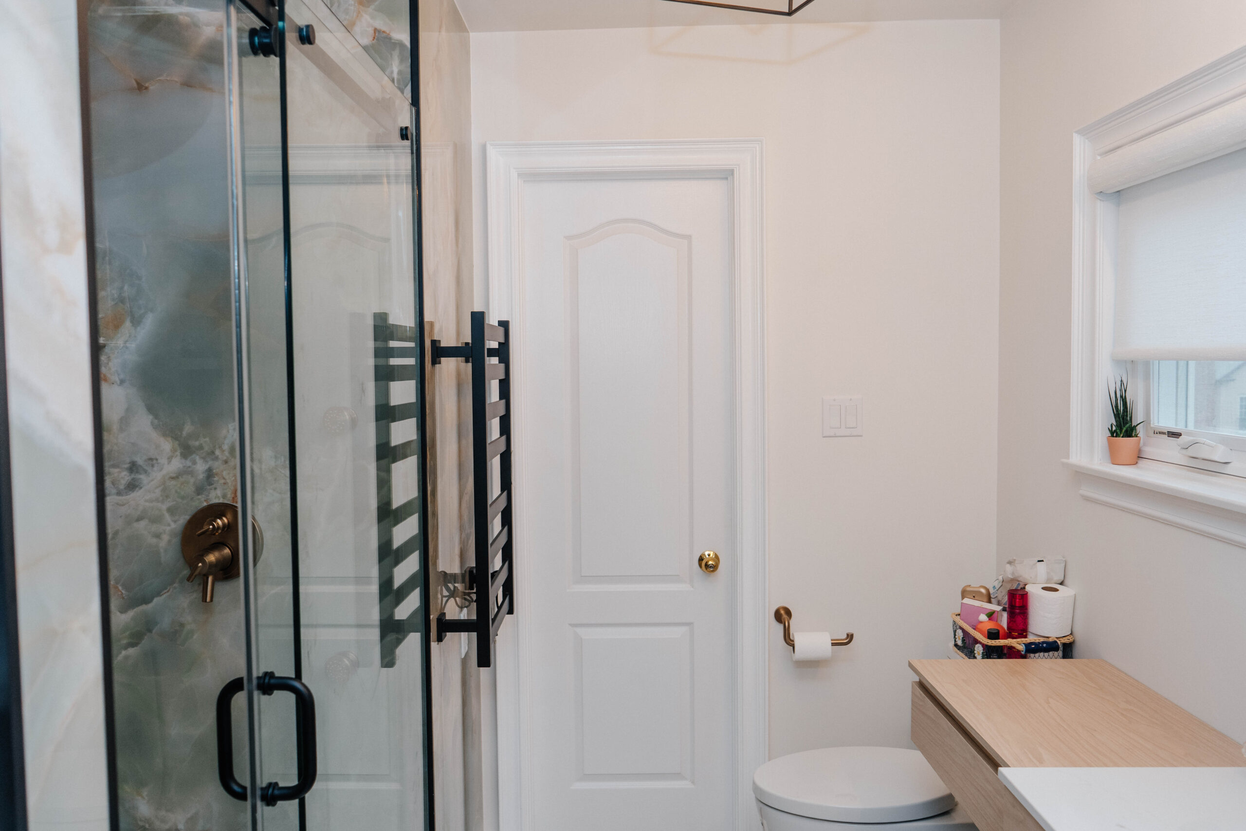 (Sink Area) Floating wood grain vanity with mirrored medicine cabinet and side storage unit