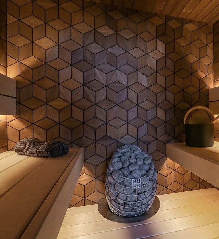 Custom sauna design build in Toronto featuring textured geometric wood wall and Huum heater