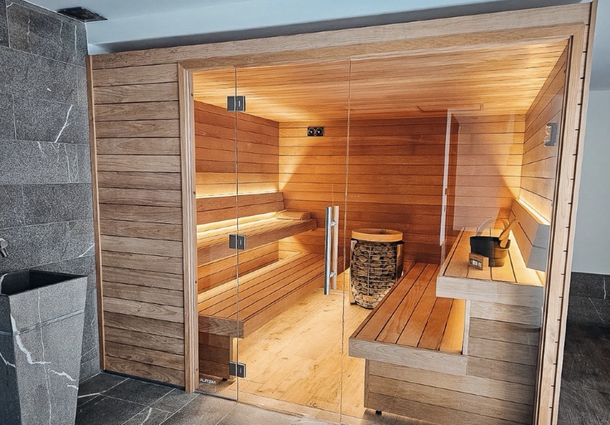 sauna renovation GTA featuring large glass enclosure and accessible layout