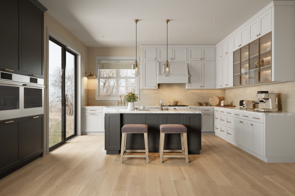 A bright, spacious kitchen with classic white Shaker style perimeter cabinets and a large dark grey island