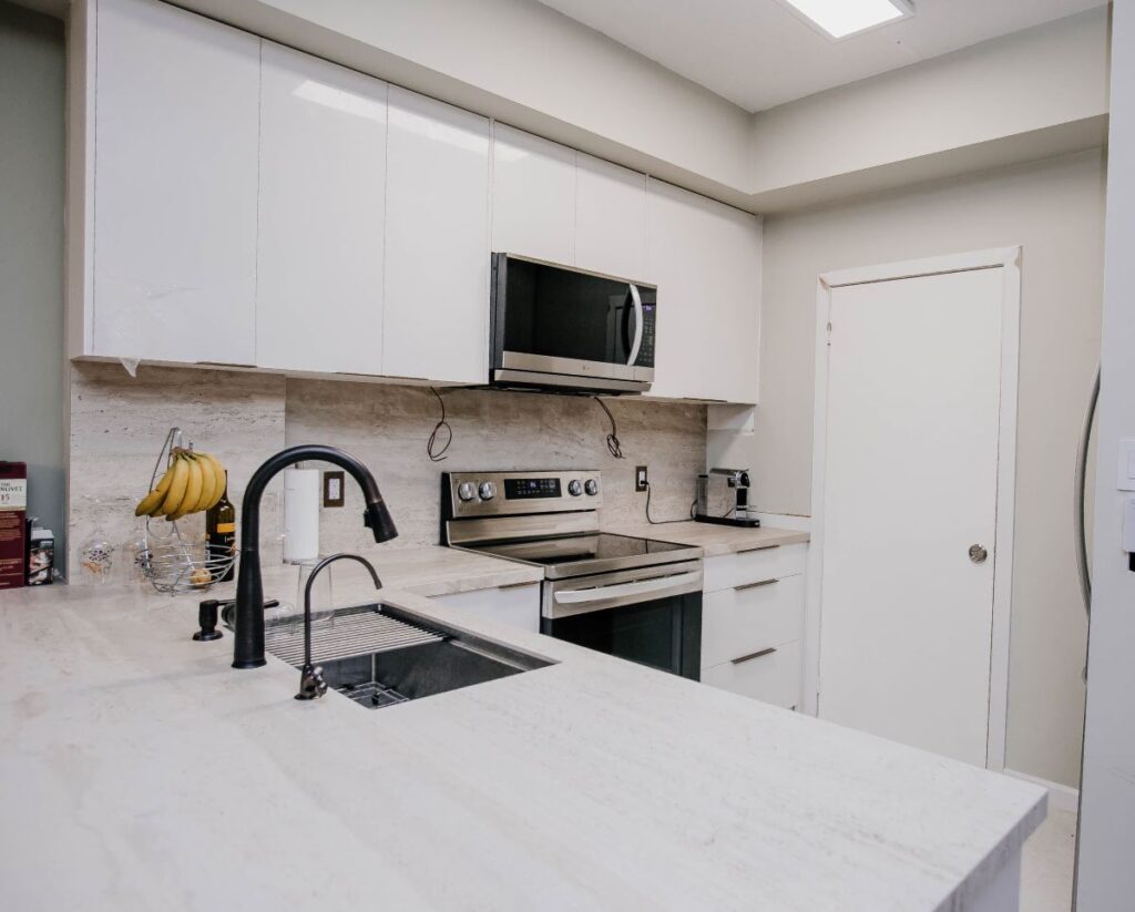 modern white kitchen renovation in downtown Toronto condo