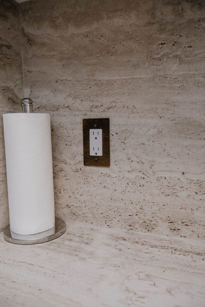 quartz backsplash and outlet detail in modern condo kitchen