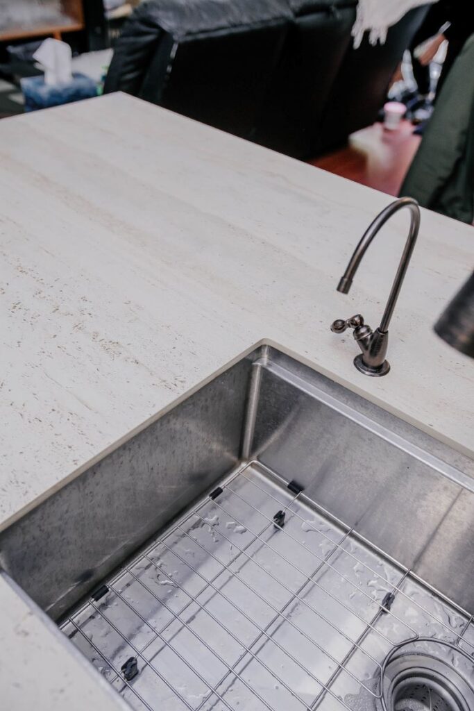 undermount sink and quartz countertop close up in condo kitchen