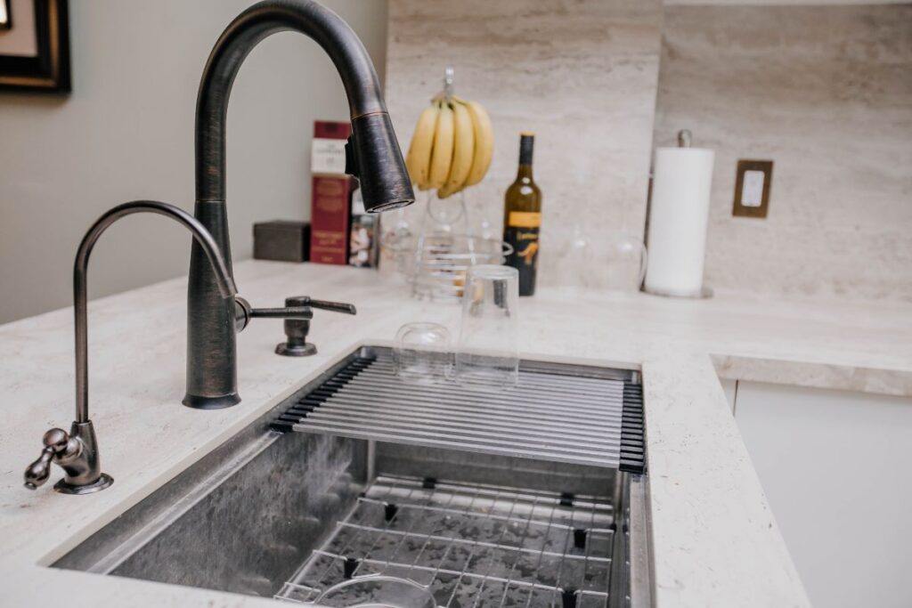 white condo kitchen cabinets and cooking area in Toronto renovation