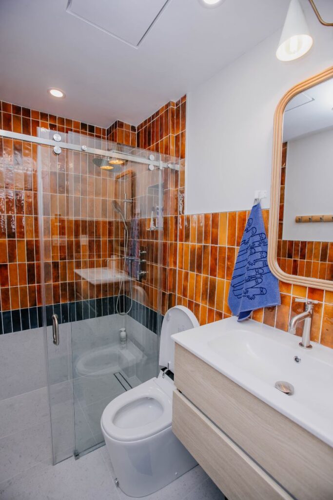Three piece bathroom remodel with floating vanity, smart toilet and glass shower enclosure
