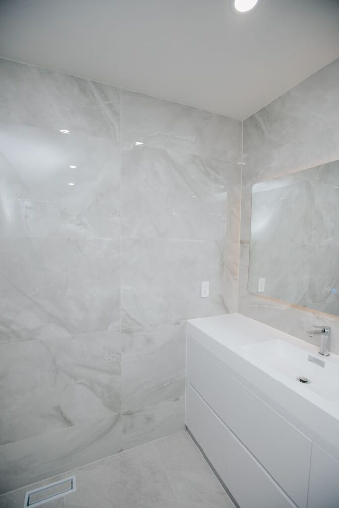 Floating vanity and LED mirror, bathroom renovation in York University Heights, North York
