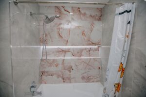Modern grey marble bathroom with floating vanity and smart toilet in North York