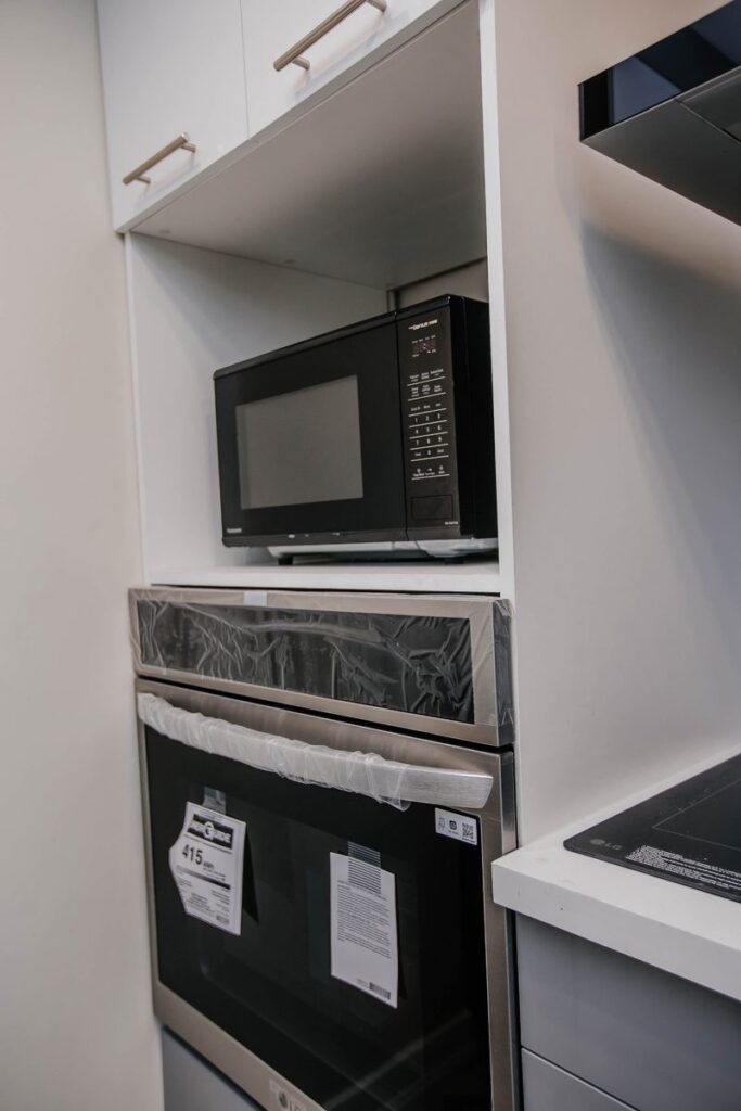 built in microwave wall oven tower white cabinetry scarborough condo kitchen