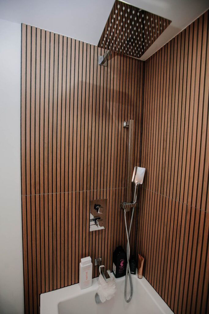 chrome rain shower hand shower wood slat tile scarborough condo tub
