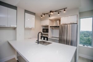 condo kitchen quartz waterfall peninsula forest view scarborough toronto renovation