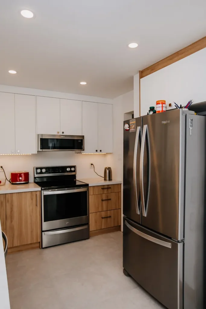 fridge and pantry wall finished flush with ceiling height cabinets in renovated mississauga kitchen corner