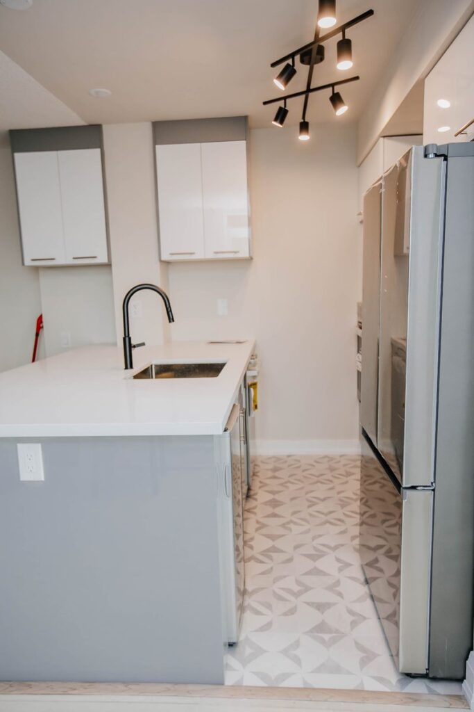galley kitchen black faucet track lighting scarborough town centre condo renovation