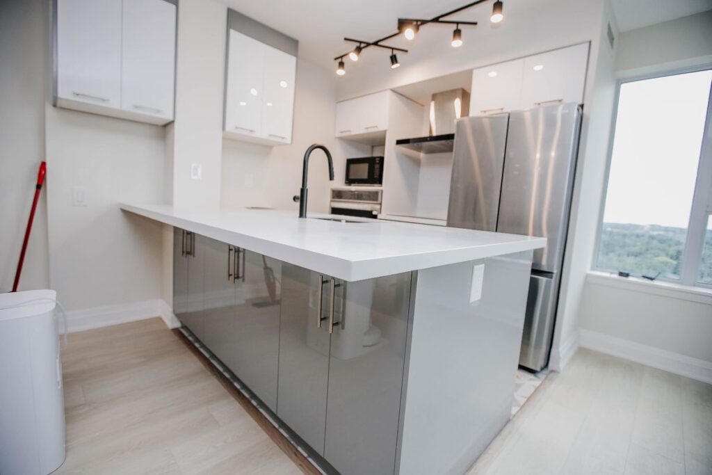 grey gloss kitchen peninsula white quartz scarborough condo renovation toronto