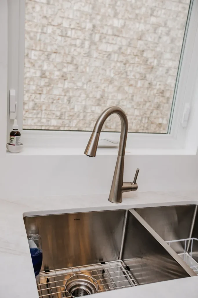 kraus double bowl undermount sink with brushed pull down faucet in renovated mississauga kitchen by magic reno