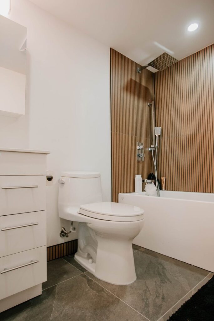 wood slat tile tub surround white vanity scarborough condo bathroom toronto