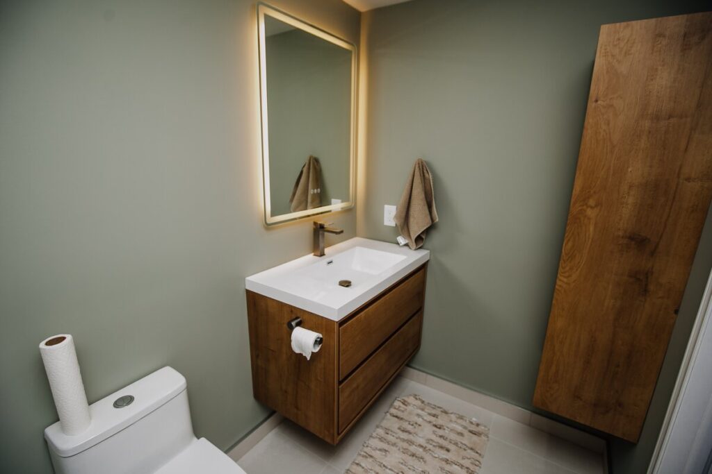 basement ensuite renovation brampton floating vanity led mirror sage green 01